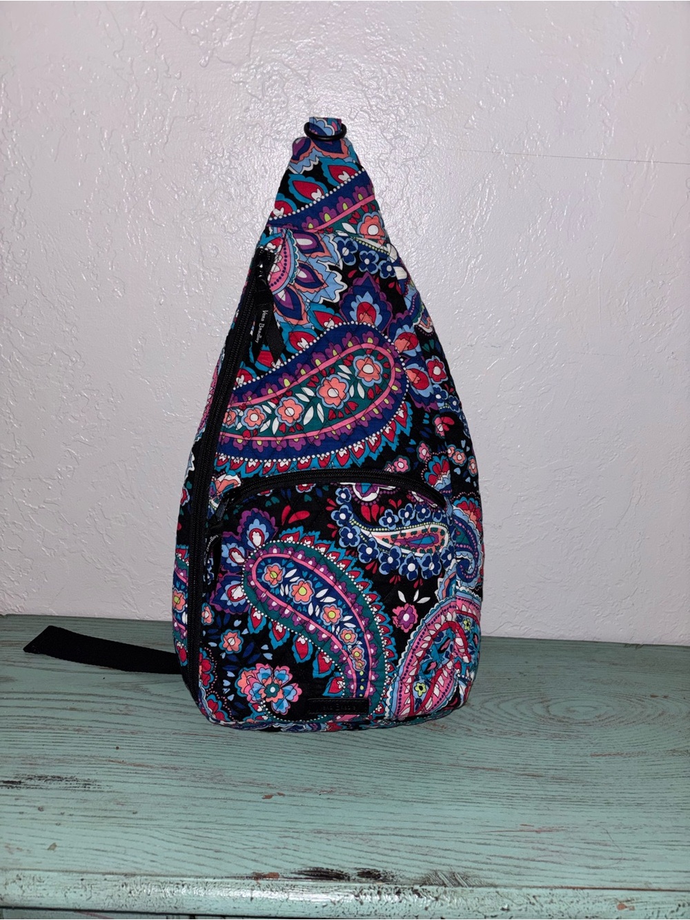Vera Bradley Essential Sling Backpack in the Haymarket Paisley pattern.